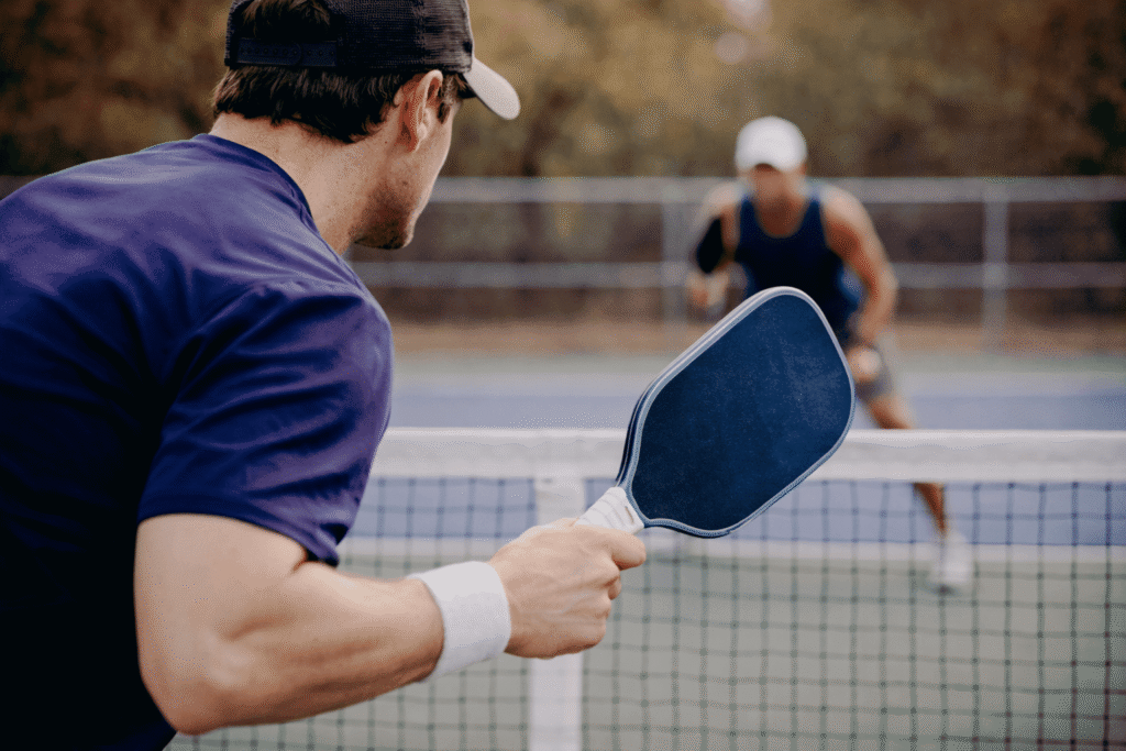 Pickleball player showing visible tension in paddle position before attempting a speed up shot